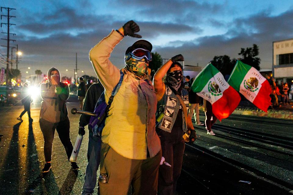 Protesters continue to march toward a law enforcement line