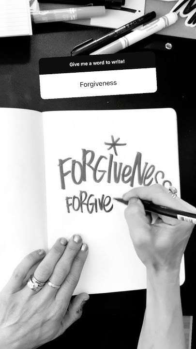 This may contain: two hands writing on a piece of paper with the word forgingne written in black and white