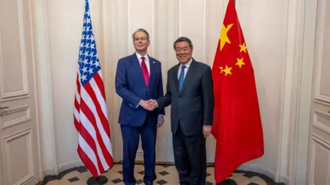 Reuters U.S. Secretary of the Treasury Scott Bessent shakes hands with Chinese Vice Premier He Lifeng during a bilateral meeting between the U.S. and China in Switzerland in May