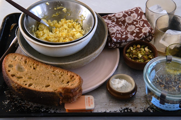 ingredients for topping and serving blended vegetable soup on a tray